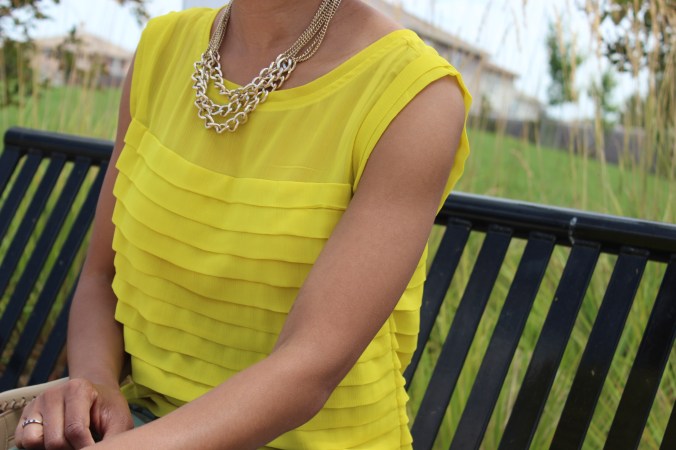 canary yellow shirt, gold chain